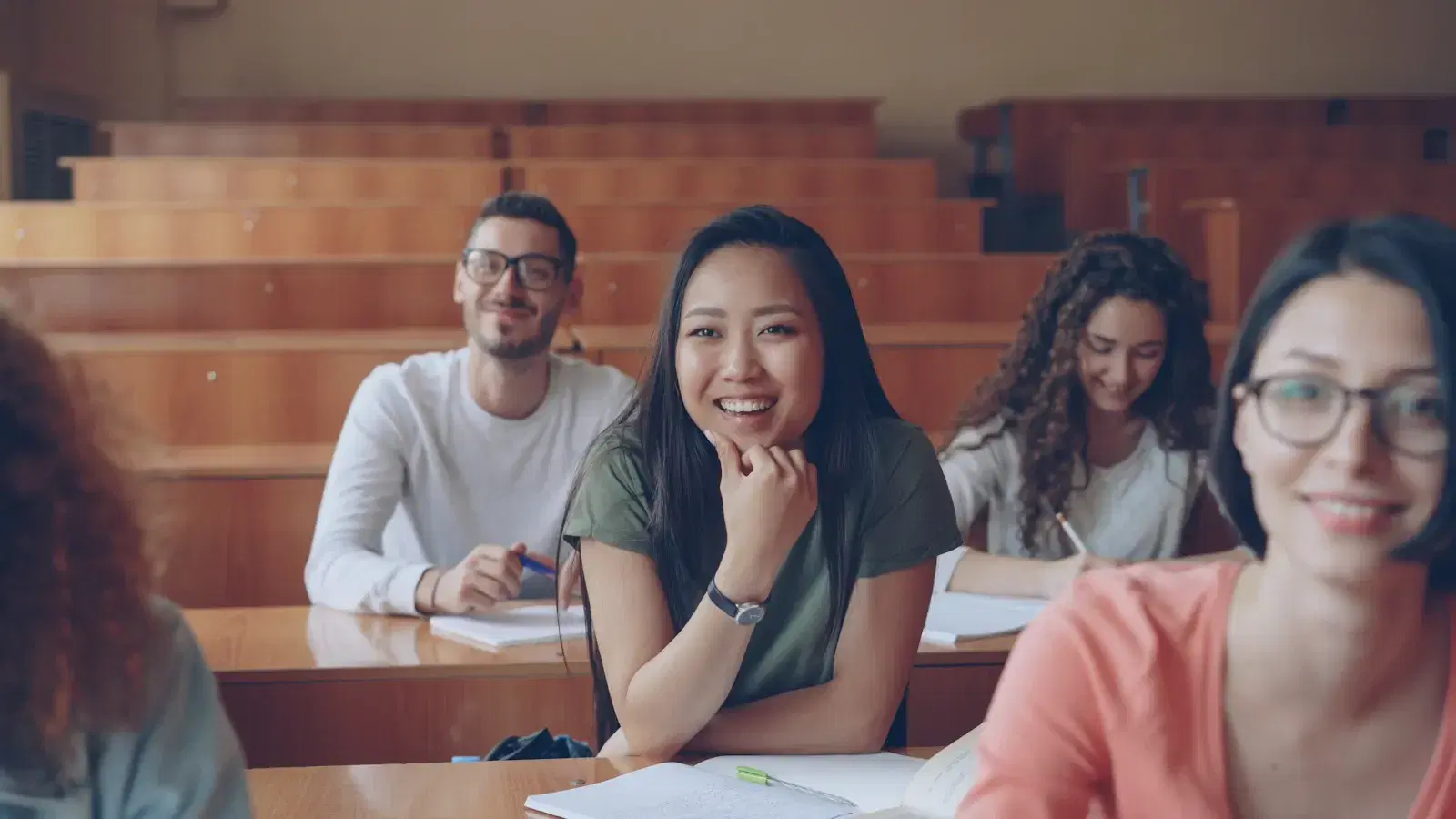 Students in a university lecture hall where AI chatbots handle admissions enquiries